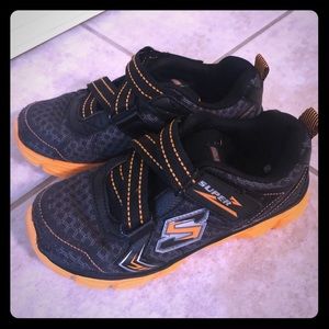 Black & orange kids Sketchers Velcro shoes